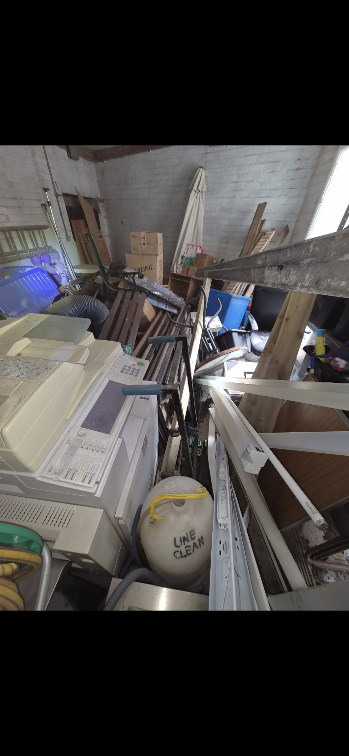 Cluttered interior room ready for a house and garage clearance