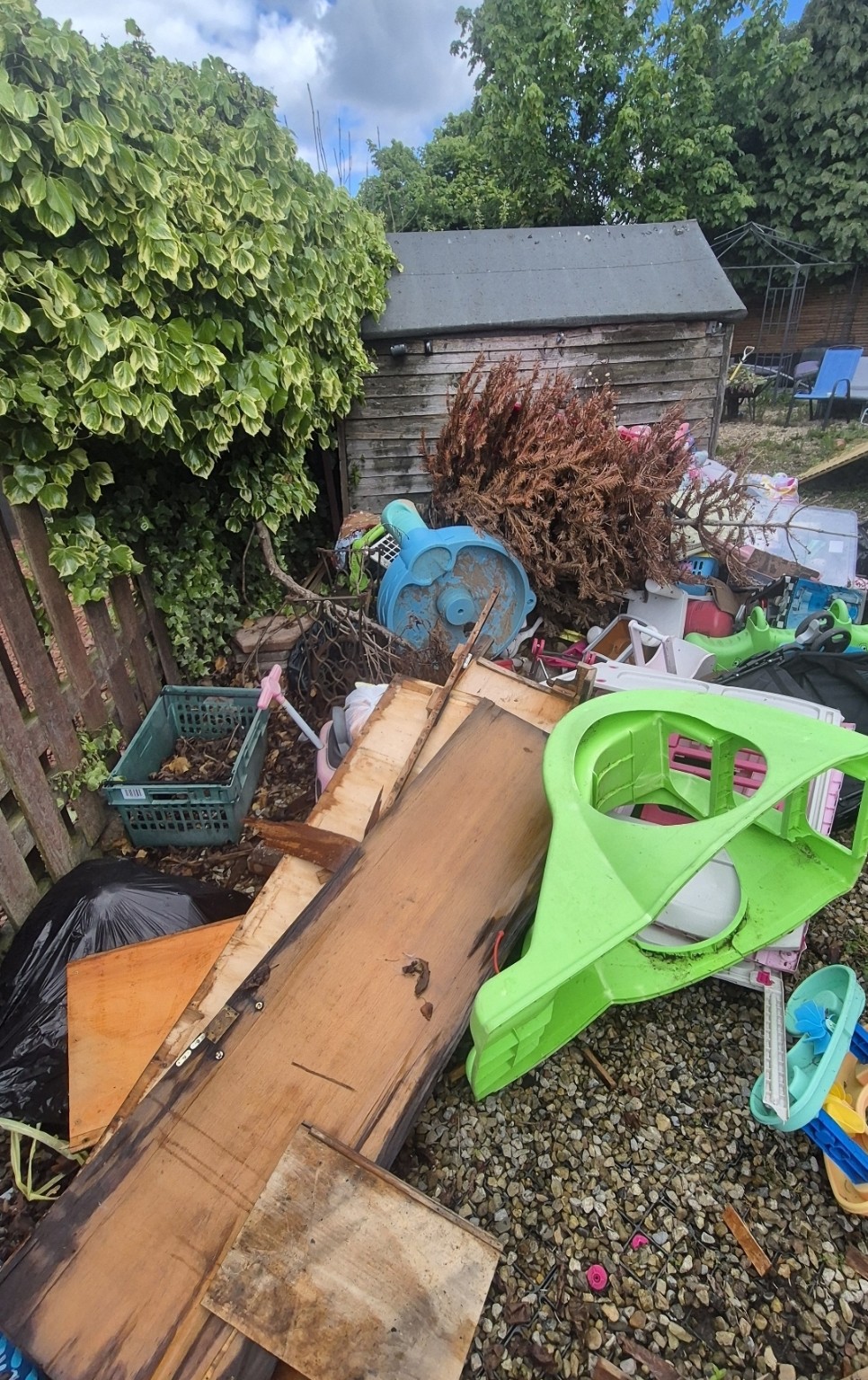 Before: Shed contents and garden clutter
